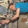 Astronaut C. Michael Foale floats in galley of the Space Station.